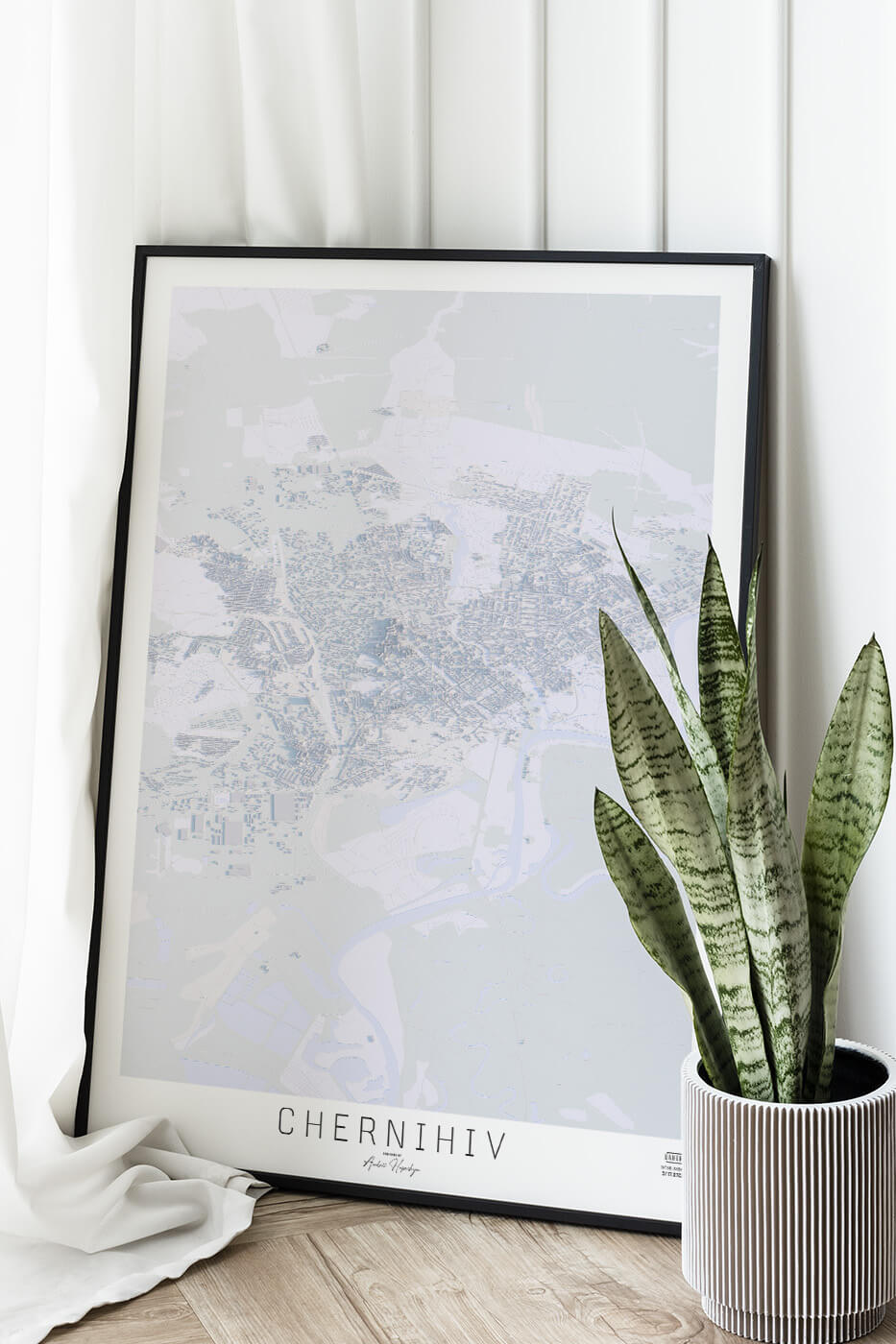 Картина міста Чернігів в рамці на фоні стіни