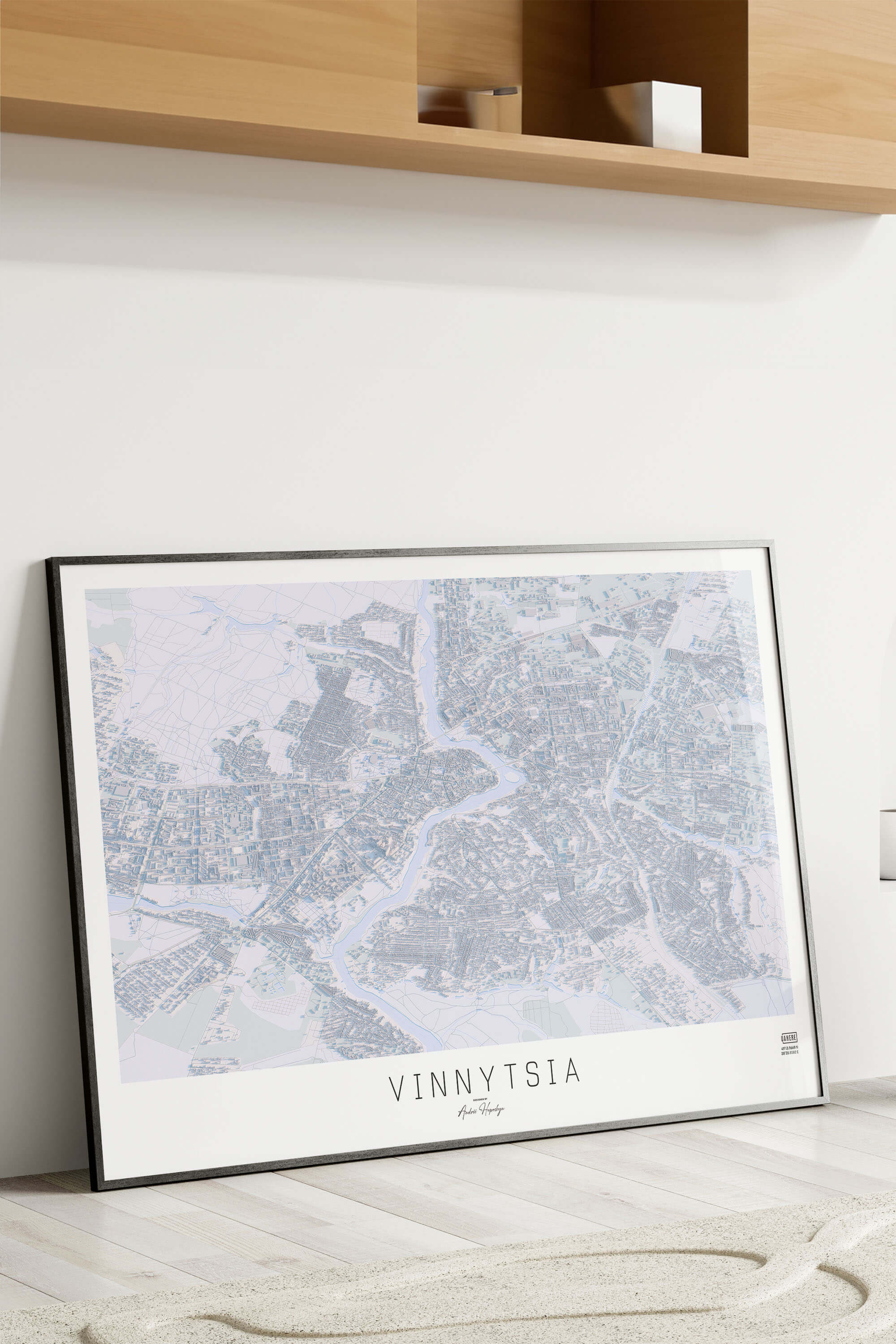 Картина міста Вінниця в рамці на фоні стіни