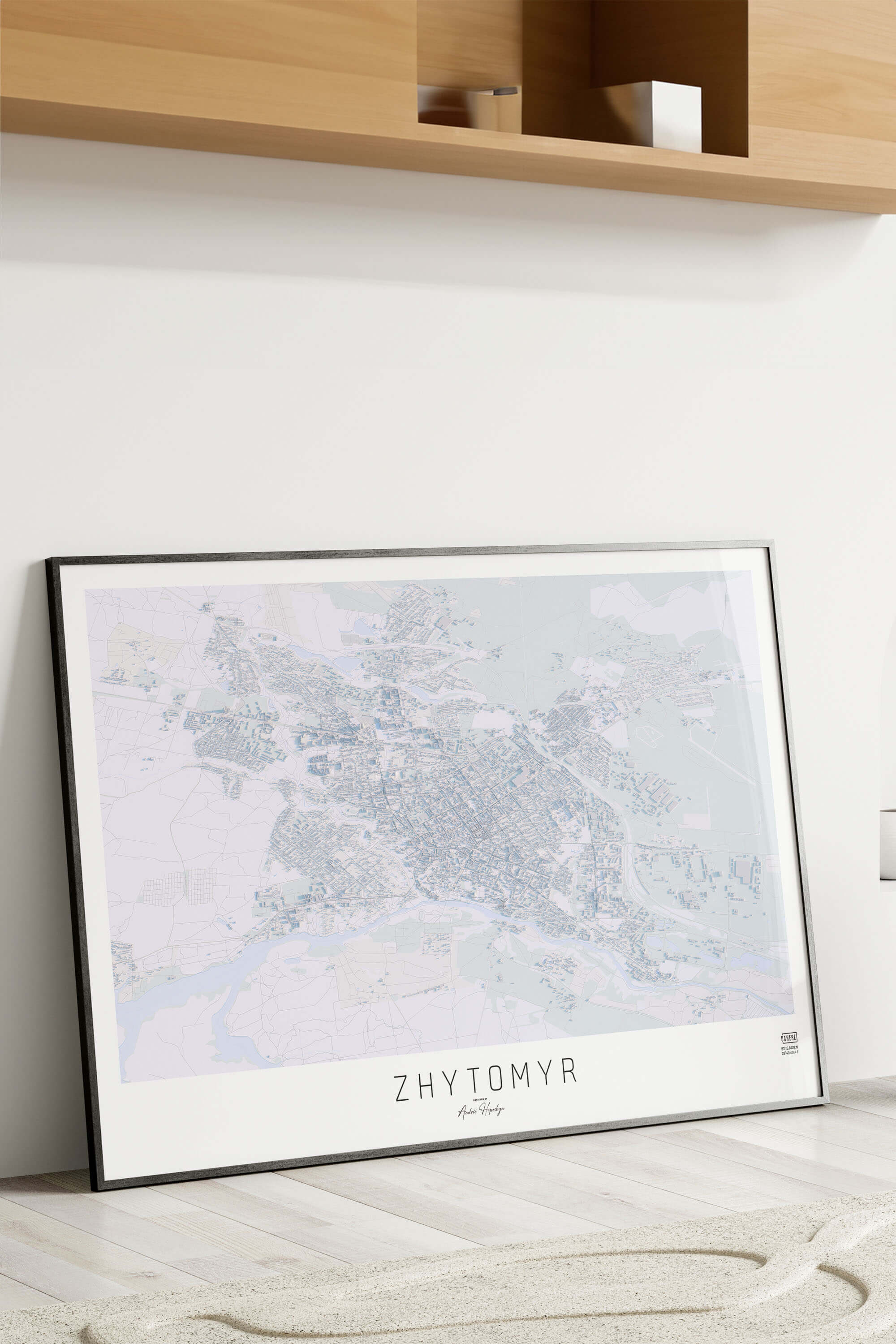 Картина міста Житомир в рамці на фоні стіни