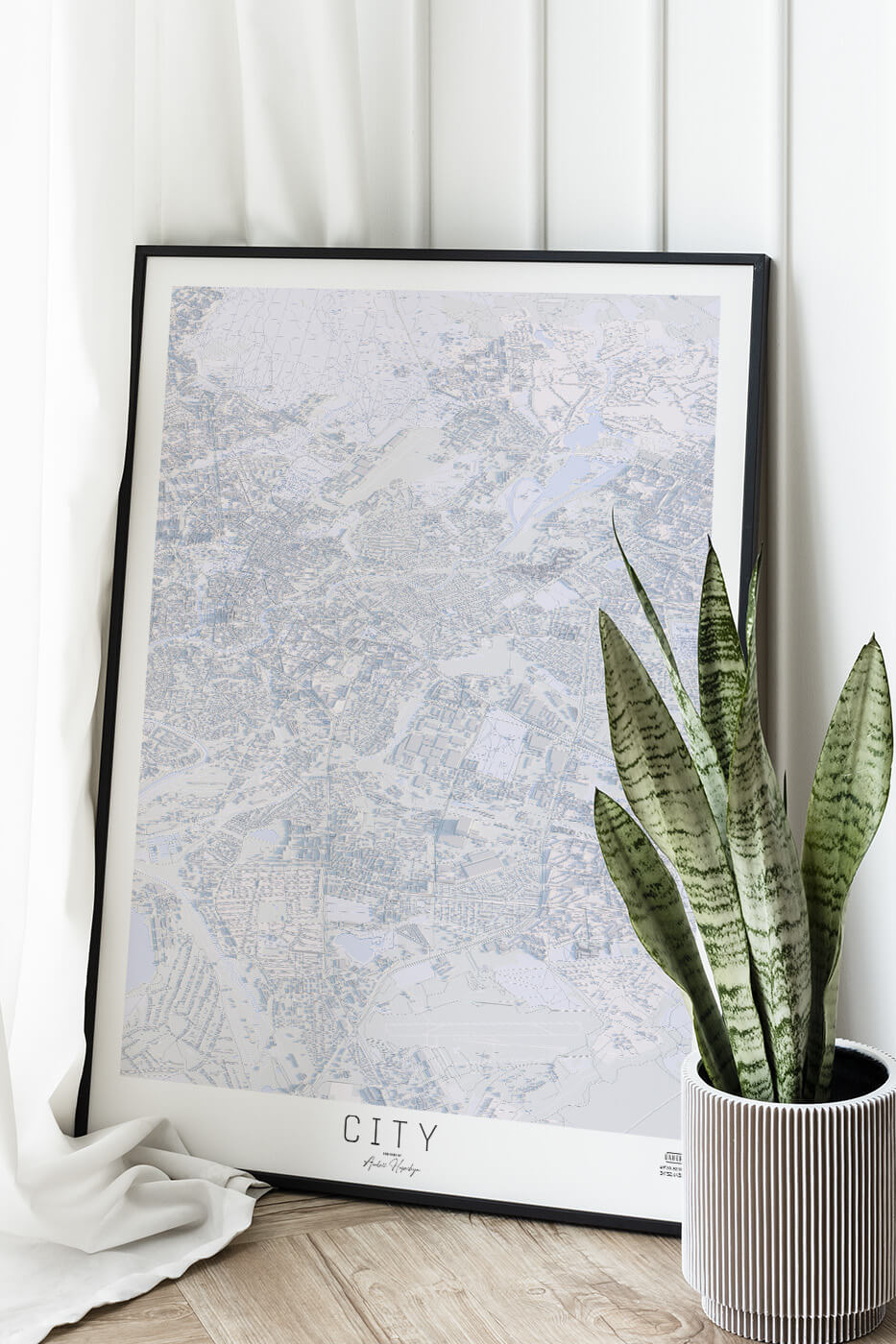 Картина міста в рамці на фоні стіни