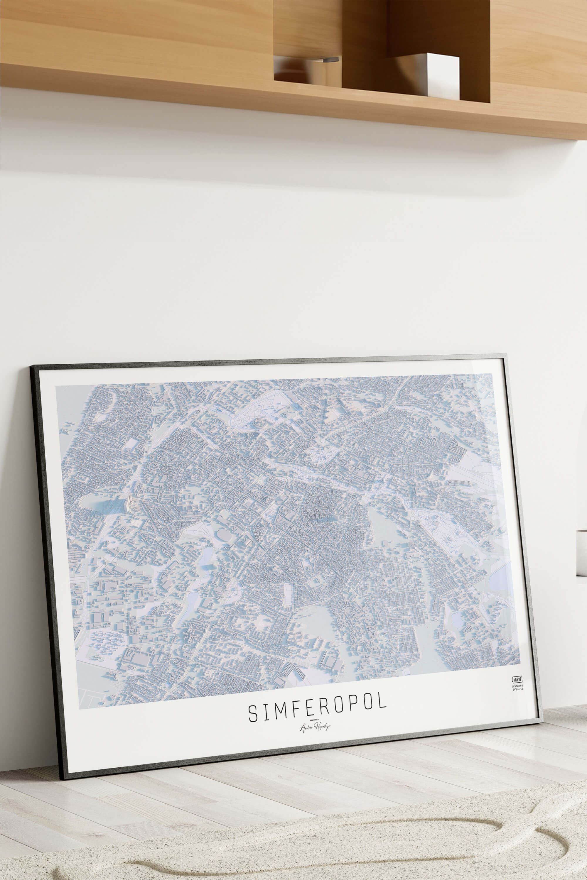 Картина міста Сімферополь в рамці на фоні стіни